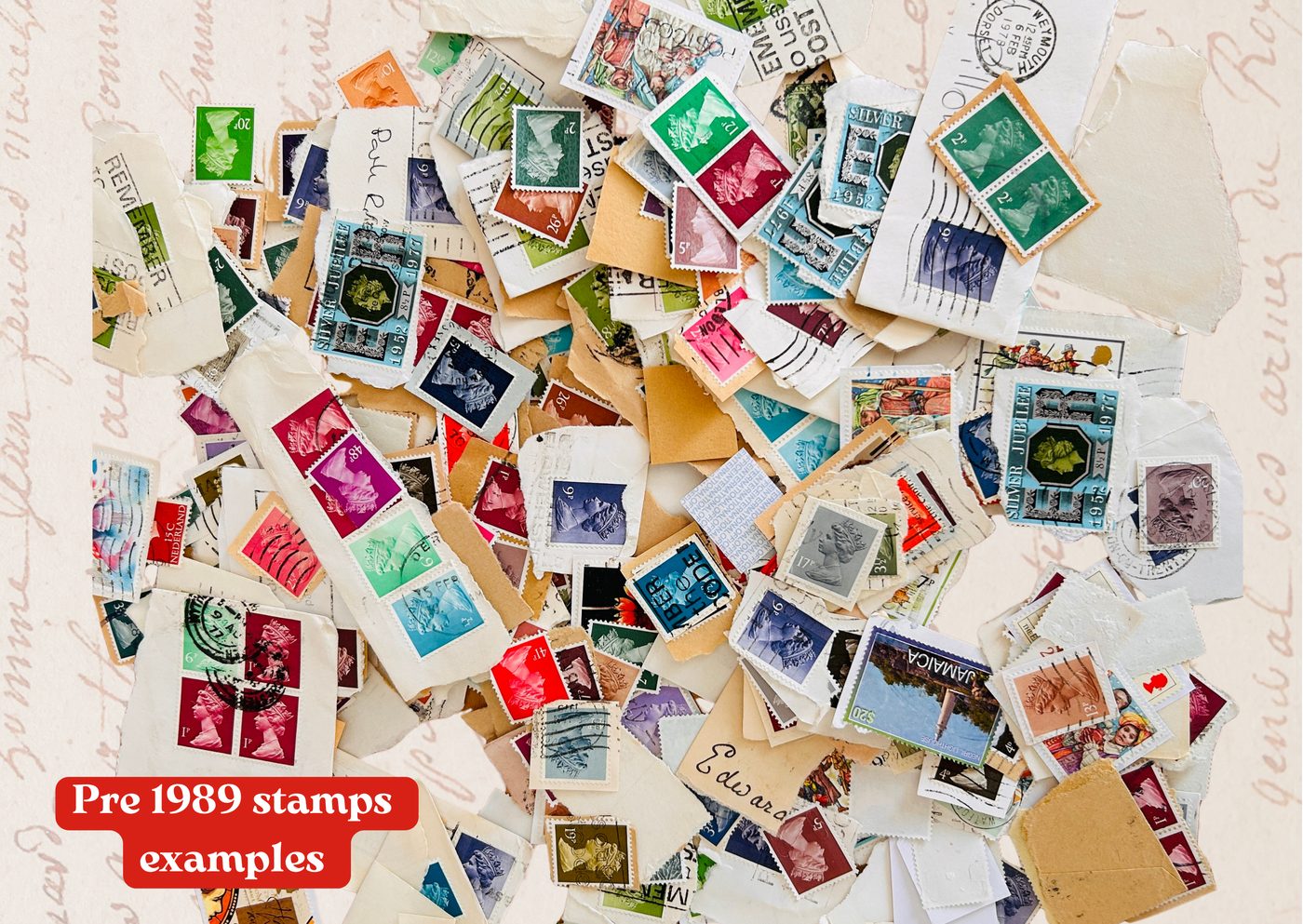 A colourful pile of used pre-1989 postage stamps &mdash; Silver Jubilees, Machins and international stamps &mdash; laid over handwritten script paper